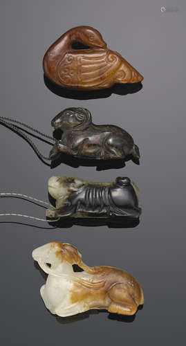 A group of four celadon jade miniature animal toggles