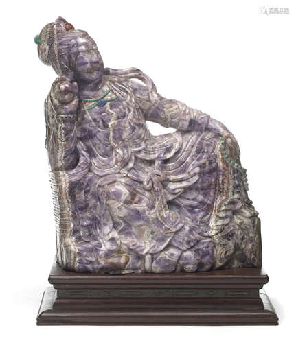 A massive purple quartz figure of a seated Guanyin 20th Century