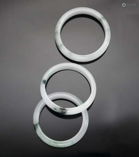 A group of three jadeite bangles