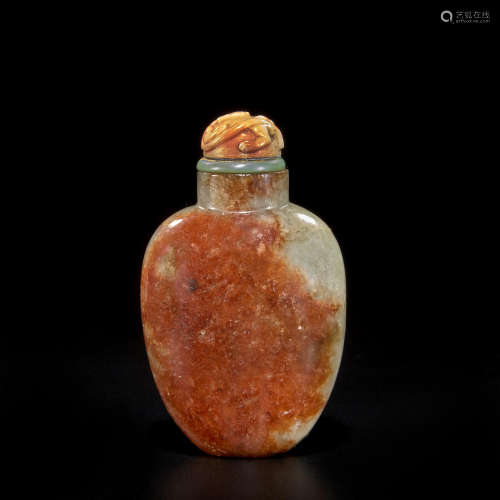 A green and russet jadeite snuff bottle 1860-1940