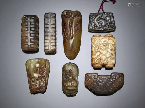 a group of eight archaistic jade carvings