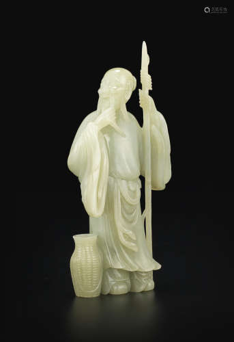A carved jade figure of a fisherman