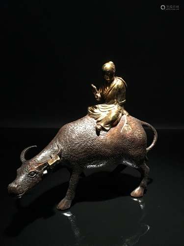 A Bronze Child Riding on a Bufflo