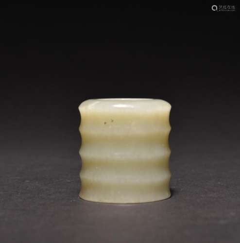 A CARVED WHITE JADE ARCHERS THUMB RING , Qing Dynasty