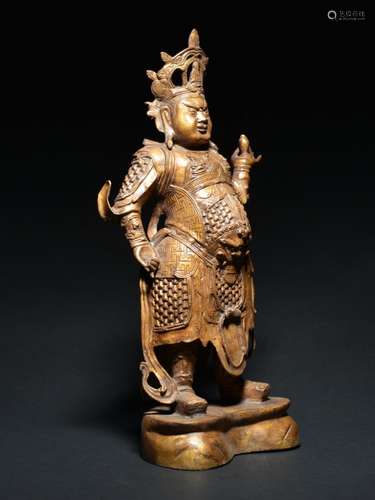 A LACQUERED-BRONZE FIGURE OF THE KING-GUARDIAN , Ming Dynasty