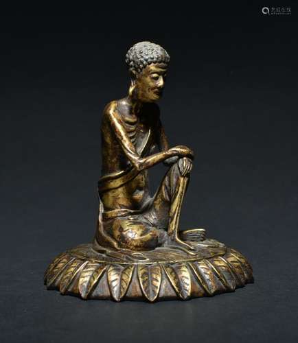 A GILT-BRONZE FIGURE OF LOUHAN , Qing Dynasty