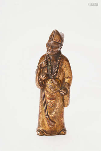 A Chinese Gilt Bronze Figure Of Man