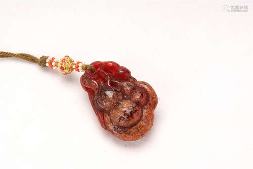 A Chinese Blood Amber Pendant