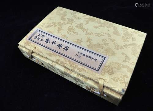 FOUR VOLUMES OF CHINESE BOOKS IN ORIGINAL CASE