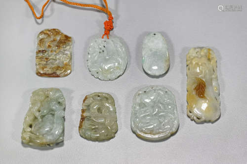 Seven Chinese Carved Jadeite Pendants