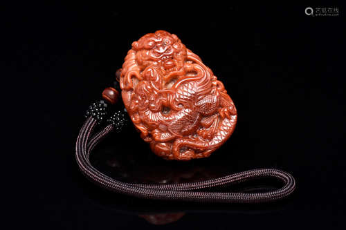 RED JADEITE CARVED 'DRAGONS' ORNAMENT WITH CERTIFICATE