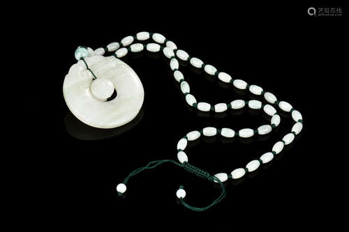 JADE CARVED 'BAGUA' PENDANT WITH NECKLACE