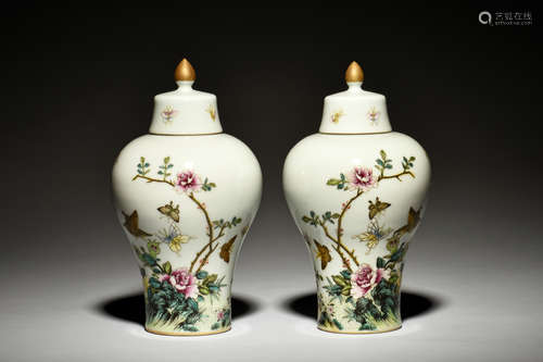 PAIR OF FAMILLE ROSE 'FLOWERS AND BUTTERFLIES' VASES WITH COVER