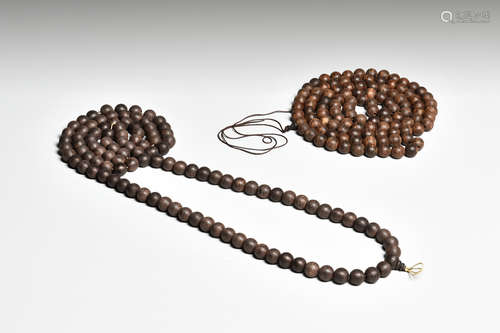 TWO AGARWOOD BEAD COURT NECKLACES