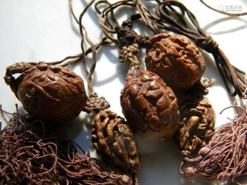 Five Antique Chinese Carved Pit Nut Pendants