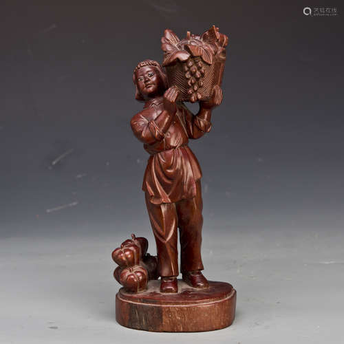 A WOOD CARVED FIGURE