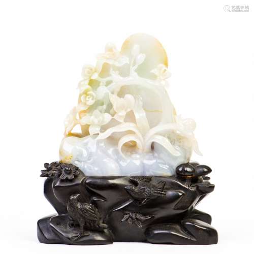 A CARVED 'FLOWER' JADE WITH STAND