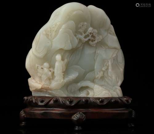 A pale celadon jade boulder carving, Qing dynasty,