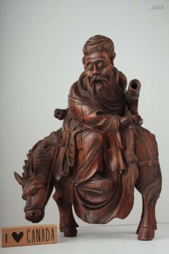 A carved wood figure of a scholar 17th/18th c.,