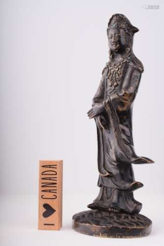 An antique Chinese bronze figure of Guanyin,