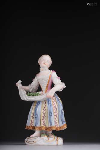 A porcelain figure of a lady, 19th century,