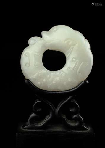 A white jade 'C' dragon pendant, Ming dynasty,