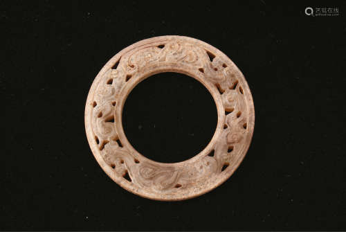 A Chinese Carved Jade Ring with Dragon