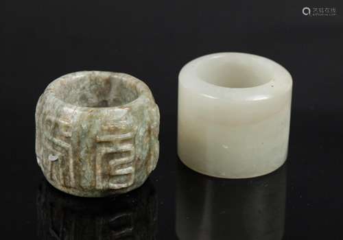 TWO CHINESE JADE THUMB RINGS