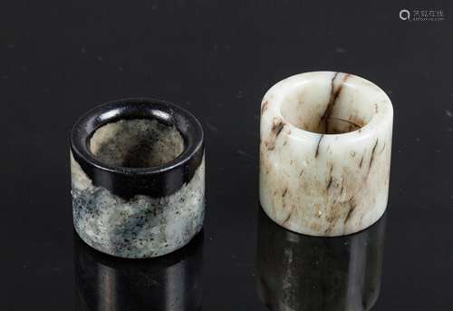 TWO CHINESE JADE THUMB RINGS