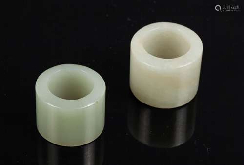 TWO CHINESE JADE THUMB RINGS