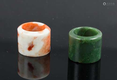 TWO CHINESE JADE THUMB RINGS