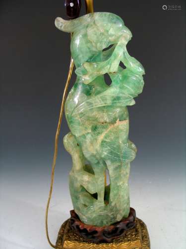 Chinese stone figure made into a lamp.