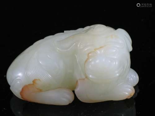 Chinese white jade carving of  a foo dog.