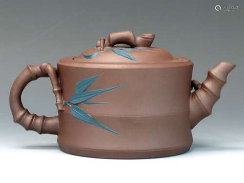 Chinese Yixing teapot with bamboo leaves decoration.