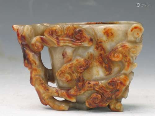 Chinese carved celadon and russet jade cup