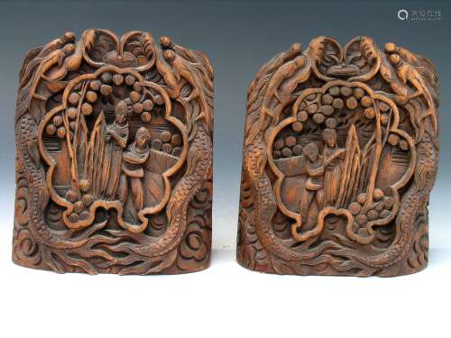 Pair of carved wood bookends.