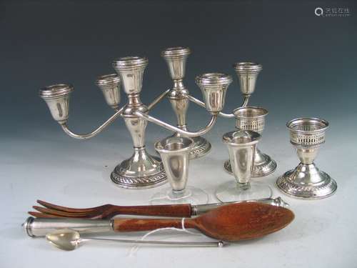 Group of sterling silver candle holders.