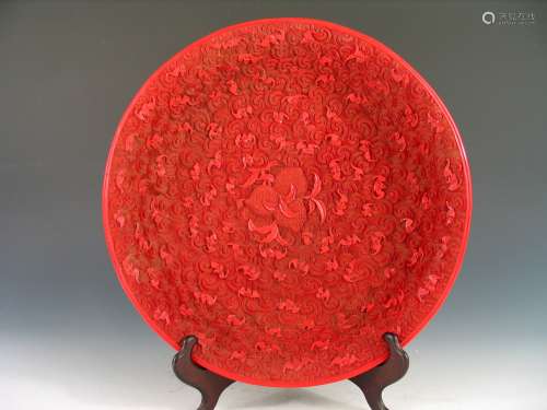 Chinese carved cinnabar charger, Qianlong Mark.