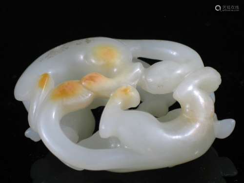 Chinese white Jade toggle of two cats.