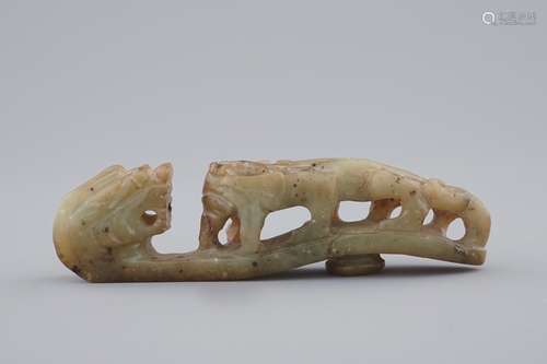 A Chinese mottled jade belt hook, 20th C.