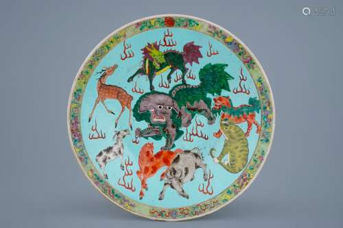 A Chinese turquoise ground famille rose charger with animals, 19th C.