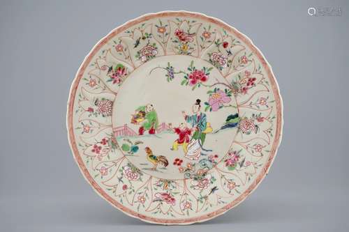 A Chinese moulded famille rose on cream ground plate with a rooster thief, Yongzheng, 1723-1735