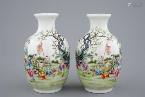 A pair of Chinese famille rose vases with playing boys, 20th C.