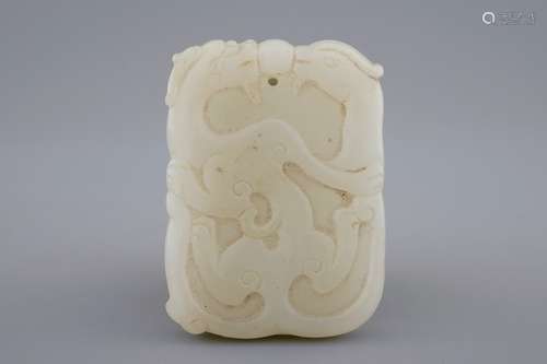 A Chinese white jade pendant with dragons and phoenixes, 19/20th C.