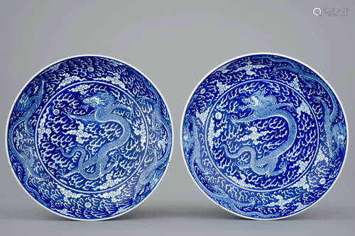 A pair of Chinese blue and white dragon dishes, Kangxi mark and of the period