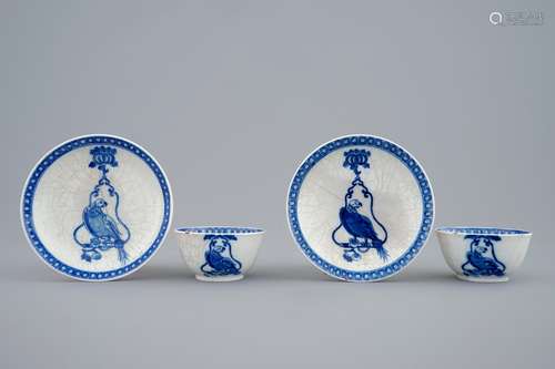 A pair of Chinese blue and white cups and saucers with 