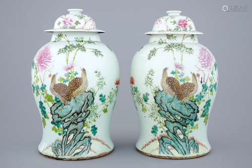 A pair of Chinese famille rose quail vases with covers, 19th C.