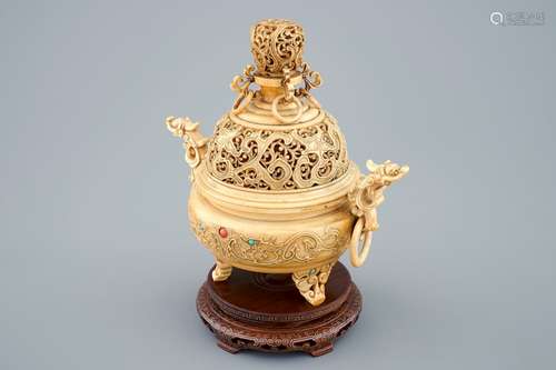 A Chinese inlaid and carved ivory tripod censer on wooden base, 19th C.