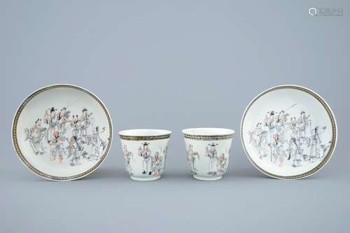 A pair of Chinese grisaille and gilt cups and saucers with immortals, Qianlong, 18th C.