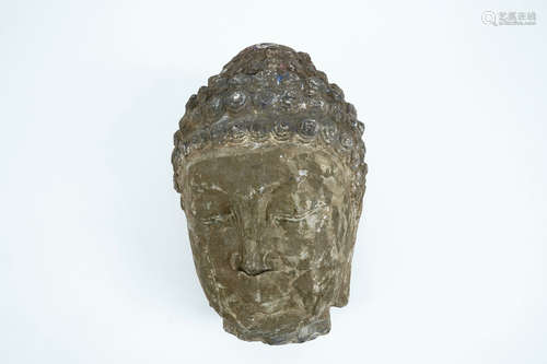 A large carved grey stone head of Buddha, China or Tibet, poss. 16/17th C.